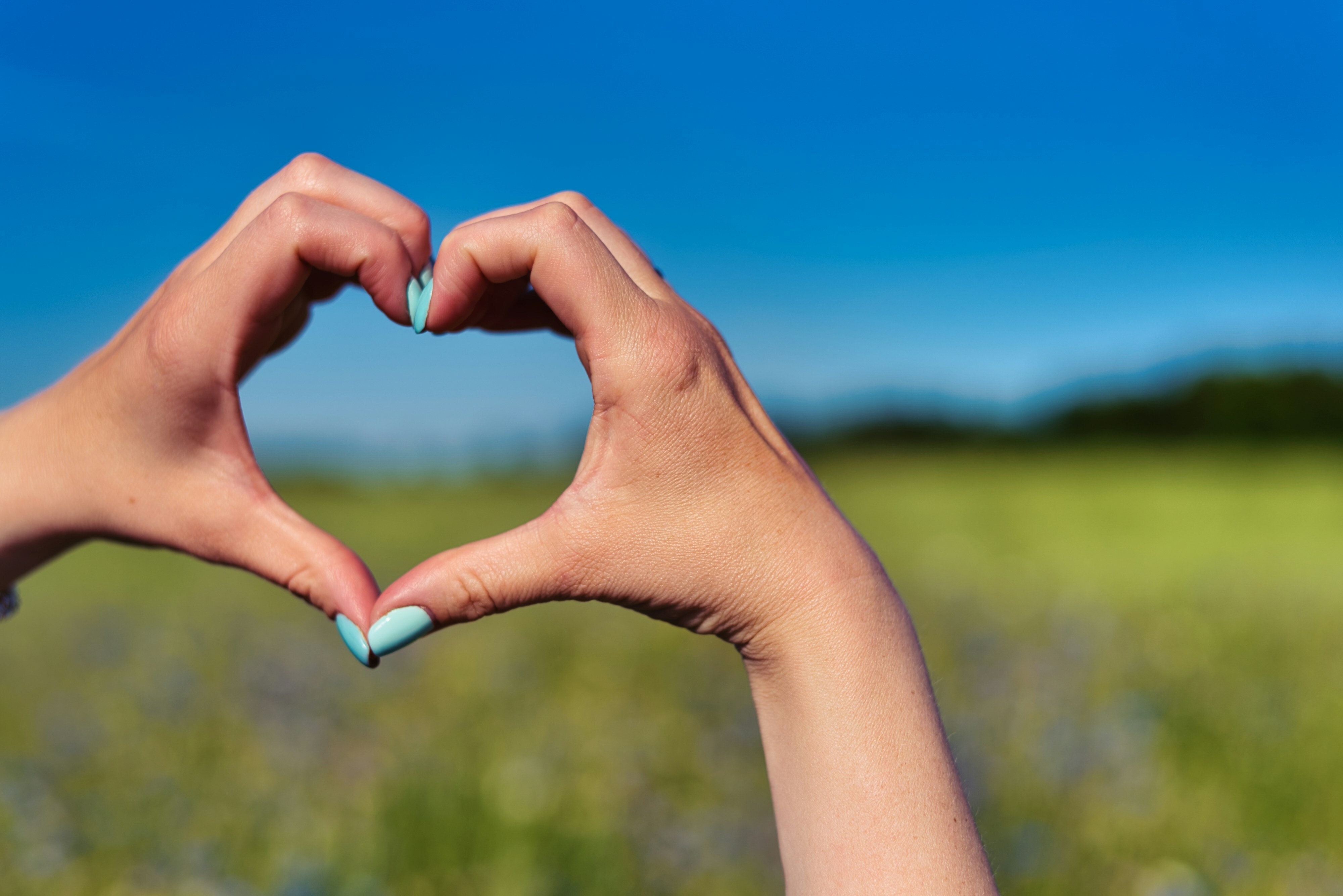 Two hands forming a heart shape